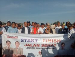 Jalan Sehat Warga Muara Sungkai Bersama Paslon Hamartoni dan Romli